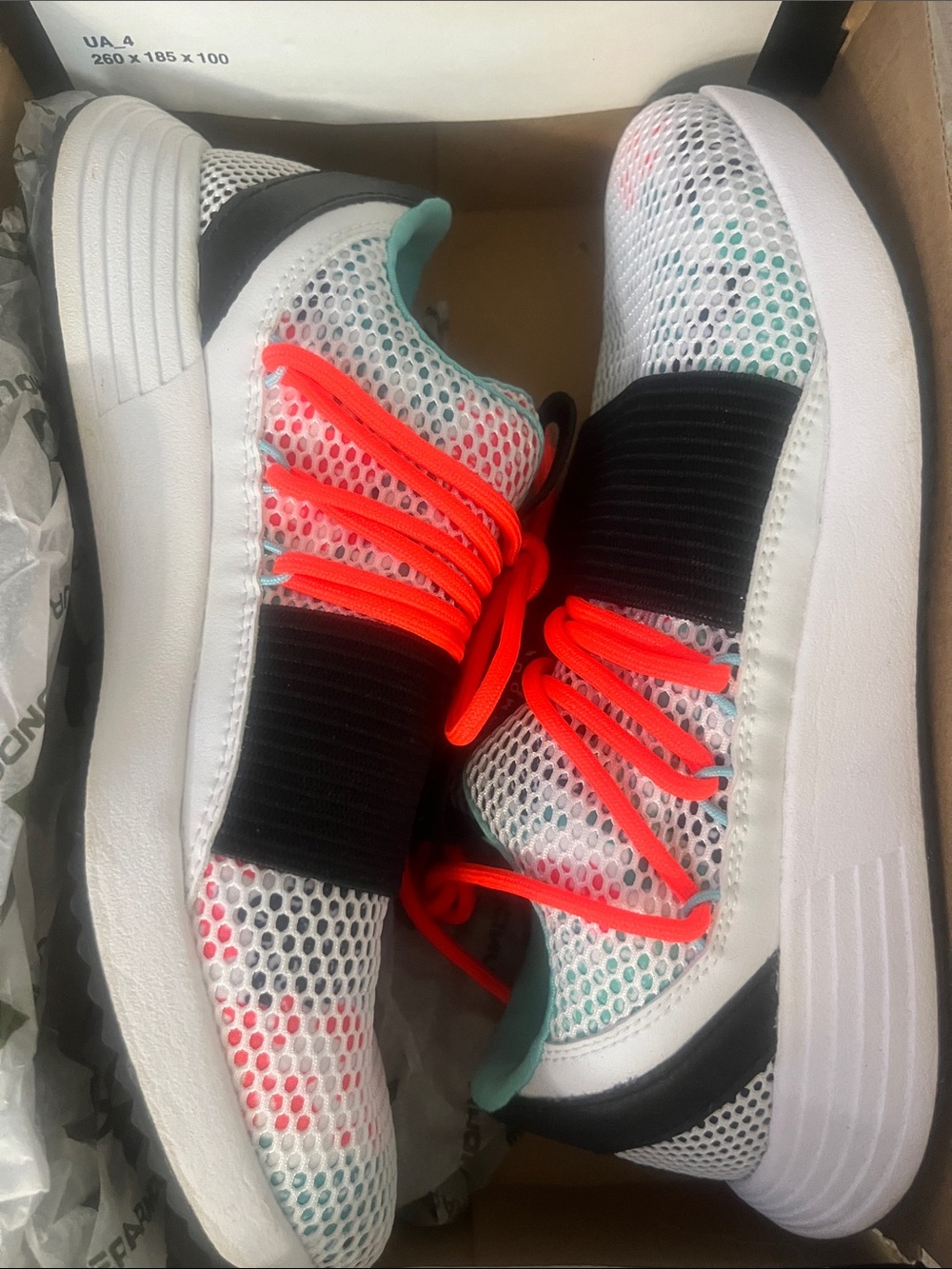 Under Armour White Mesh Kids Sneakers with Neon Orange Laces and Teal Accents